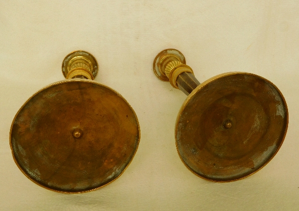 Paire de flambeaux Empire en bronze patiné et doré attribués à Ravrio, époque début XIXe