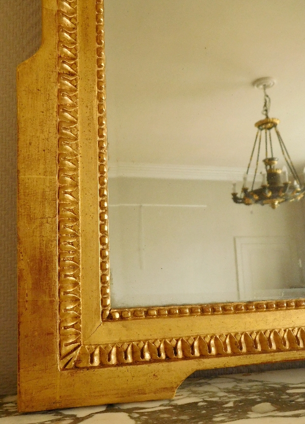 Miroir d'époque Louis XVI en bois doré au tambourin - glace au mercure biseautée 74cm x 108cm