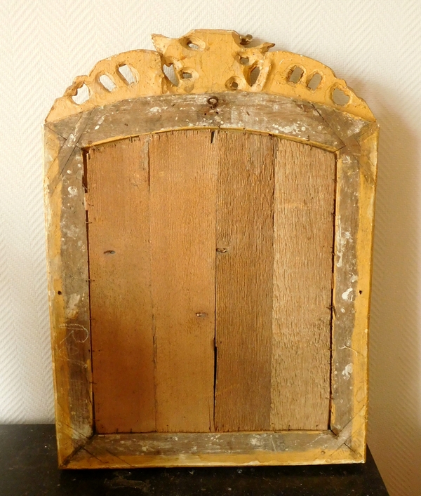 Miroir en bois doré d'époque Régence, glace biseautée