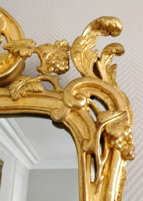 Miroir en bois doré, glace au mercure, travail Provencal d'époque Louis XV - Transition