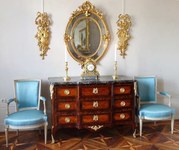 Pair of sculpted gold leaf gilt trophies, Louis XVI style woodwork