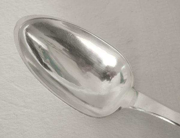 Empire sterling silver serving spoon, coat of arms engraved, early 19th century