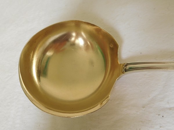 Puiforcat : sterling silver and vermeil cream ladle, Louis XVI style