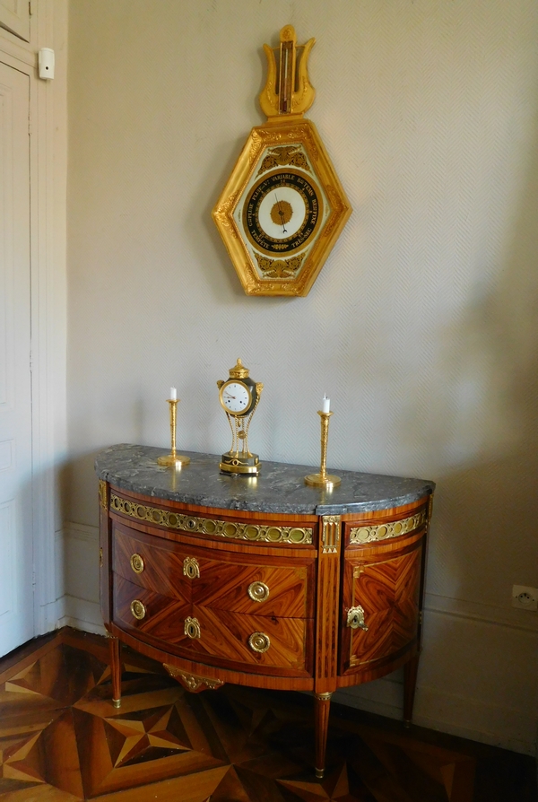 Empire barometer set into a carved and gilt wood frame - early 19th century