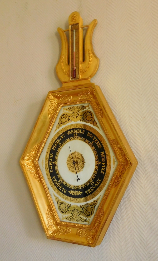 Empire barometer set into a carved and gilt wood frame - early 19th century
