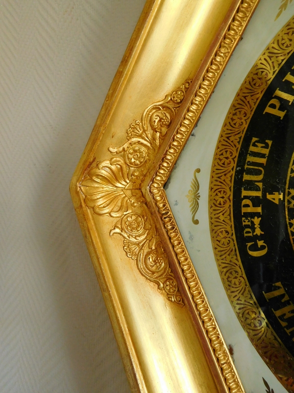 Empire barometer set into a carved and gilt wood frame - early 19th century