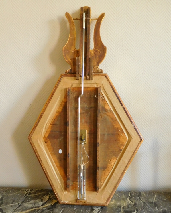 Empire barometer set into a carved and gilt wood frame - early 19th century