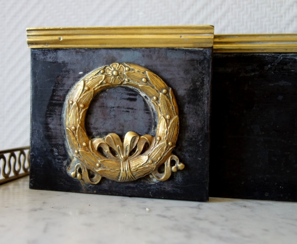 Empire patinated bronze and ormolu mantelbar, 19th century
