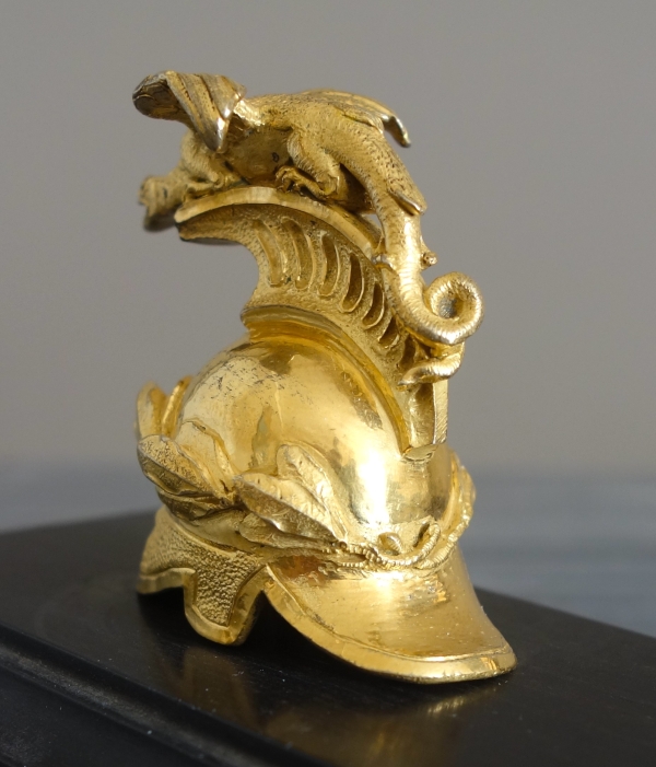 Empire ebony and ormolu paper weight, early 19th century