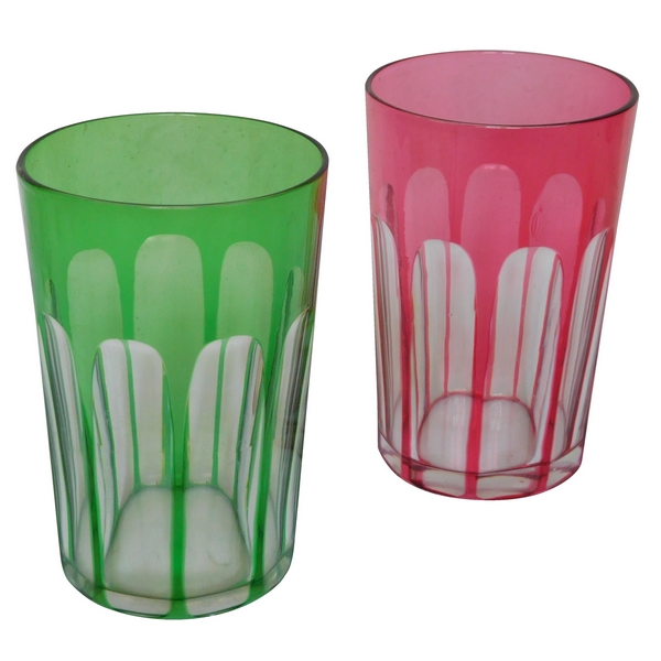 Pair of Baccarat crystal tooth glasses, pink and green overlay