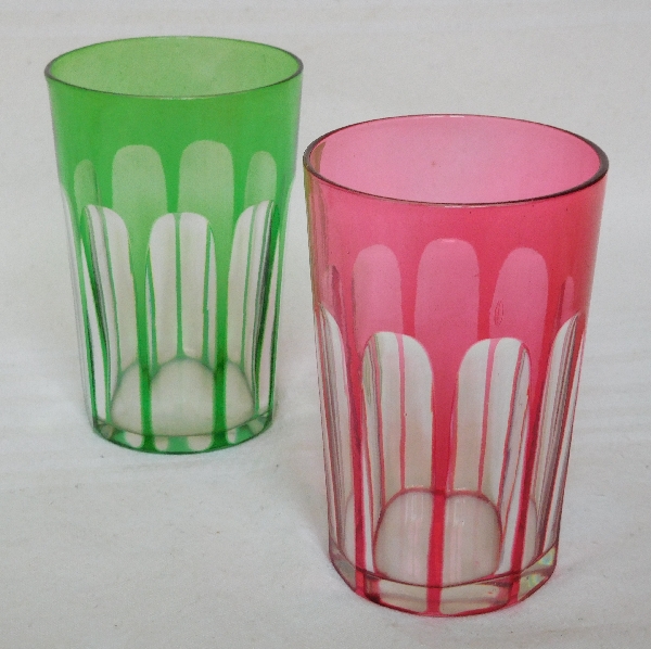 Pair of Baccarat crystal tooth glasses, pink and green overlay