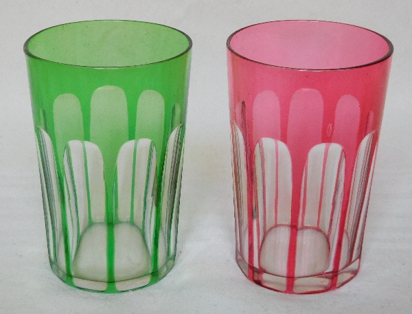 Pair of Baccarat crystal tooth glasses, pink and green overlay