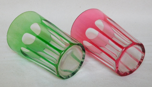 Pair of Baccarat crystal tooth glasses, pink and green overlay