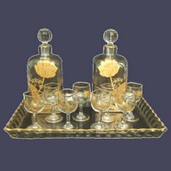 Rare Baccarat liquor set enhanced with fine gold Japanese-inspired decoration