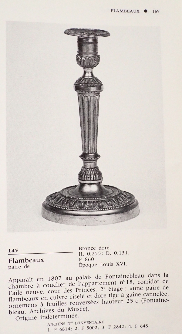 Pair of Louis XVI ormolu candlesticks, model of Fontainebleau Palace