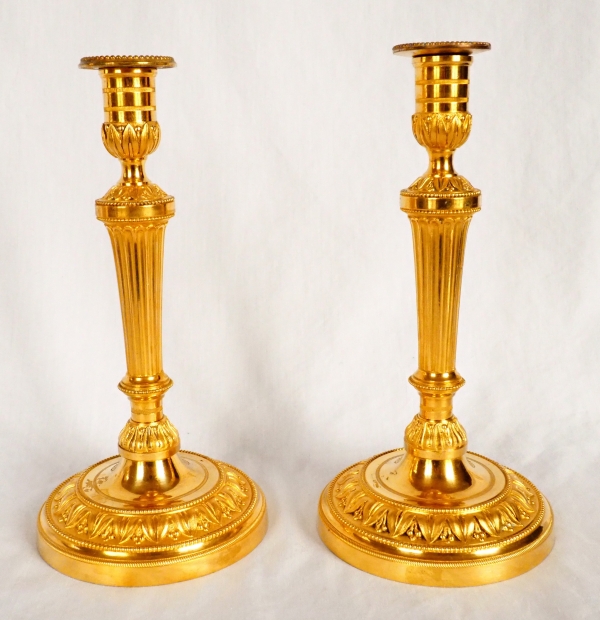 Pair of Louis XVI ormolu candlesticks, model of Fontainebleau Palace