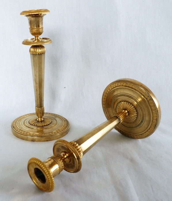 Ravrio : Pair of Empire ormolu candlesticks, early 19th century