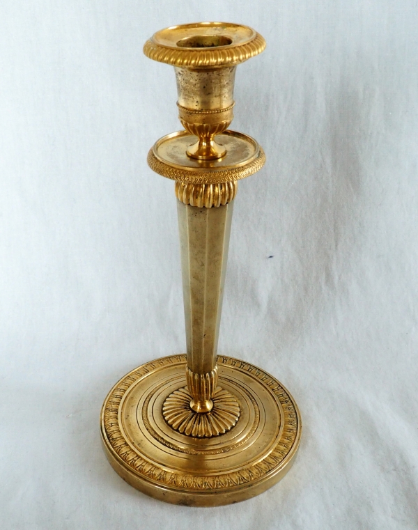 Ravrio : Pair of Empire ormolu candlesticks, early 19th century