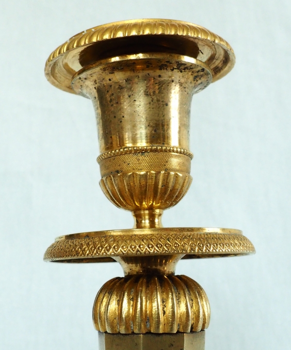 Ravrio : Pair of Empire ormolu candlesticks, early 19th century