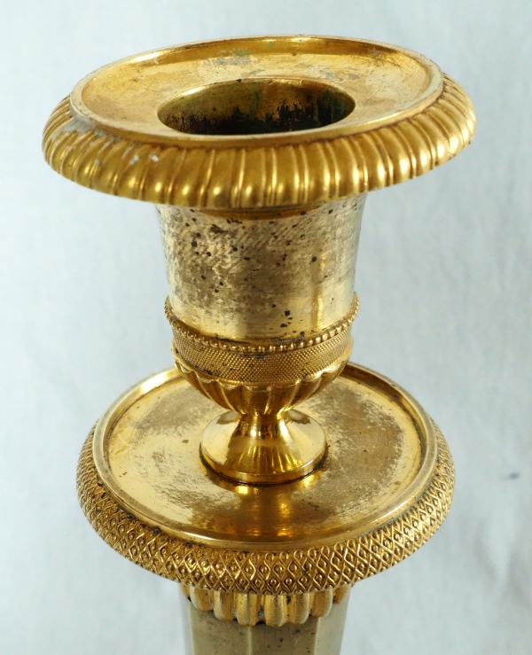 Ravrio : Pair of Empire ormolu candlesticks, early 19th century