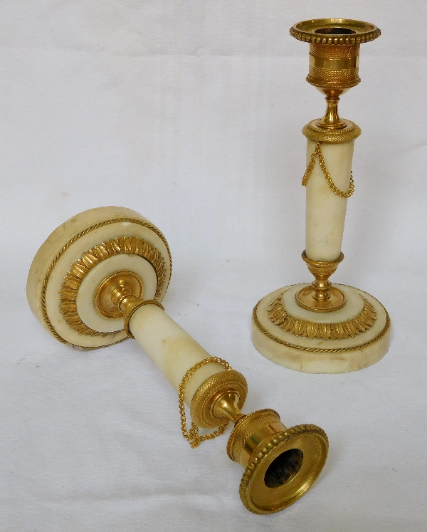 Pair of marble and ormolu candlesticks, end of Louis XVI production