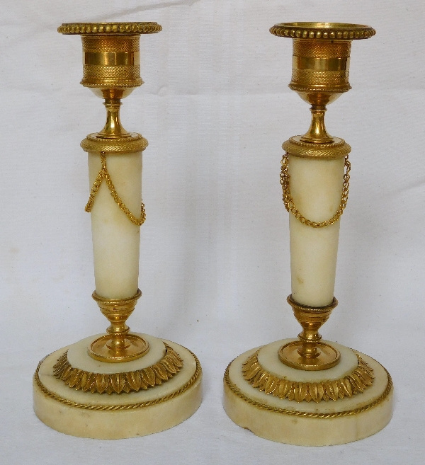 Pair of marble and ormolu candlesticks, end of Louis XVI production