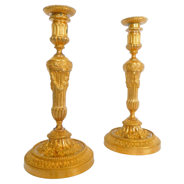 Pair of Louis XVI style ormolu candlesticks - 19th century