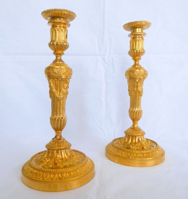 Pair of Louis XVI style ormolu candlesticks - 19th century