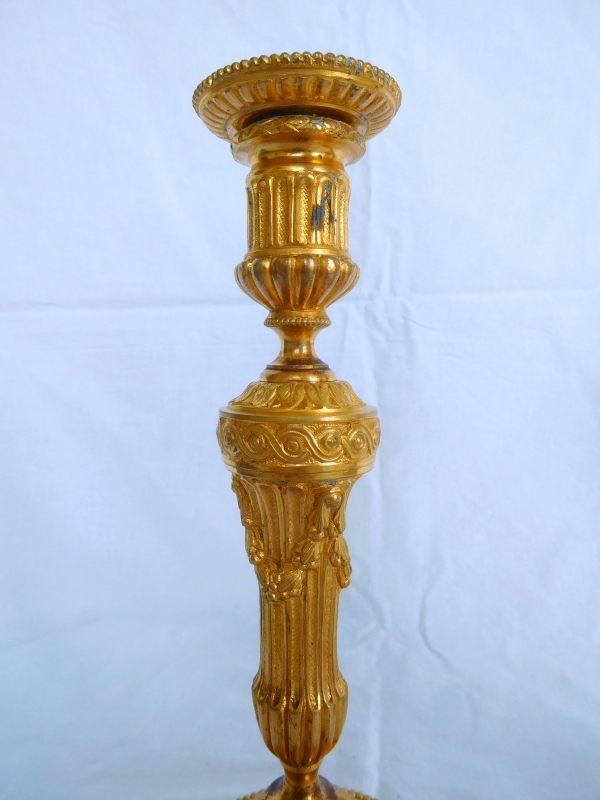 Pair of Louis XVI style ormolu candlesticks - 19th century