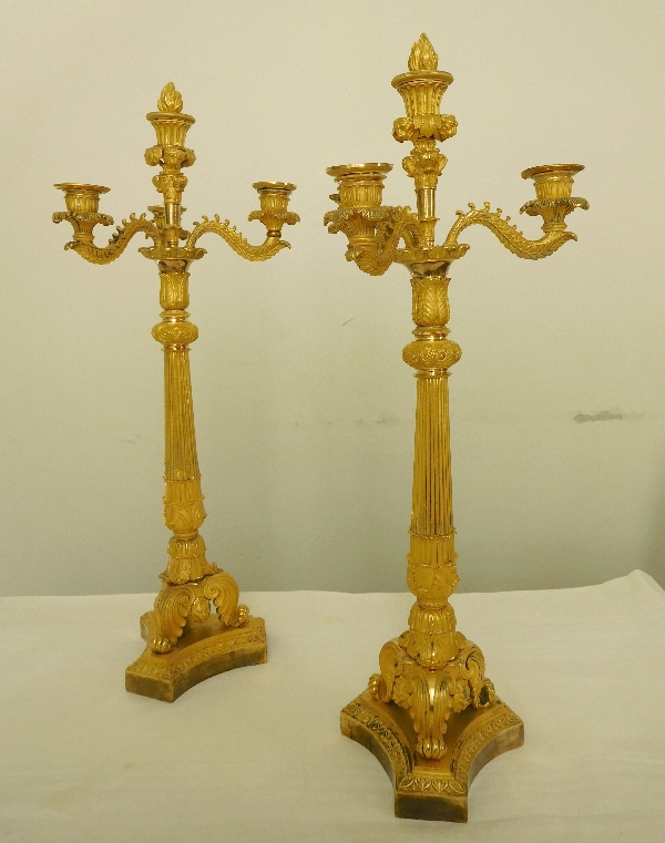 Pair of French Empire ormolu candelabras, early 19th century