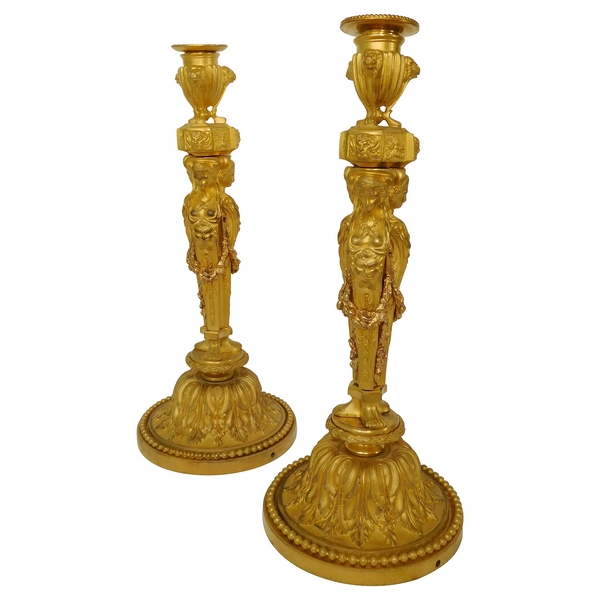 Pair of ormolu Louis XVI style candlesticks, after Jean Demosthene Dugourc