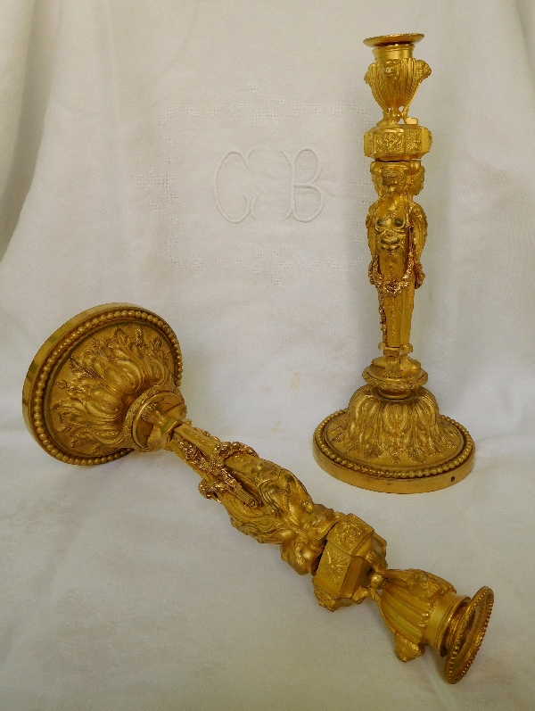 Pair of ormolu Louis XVI style candlesticks, after Jean Demosthene Dugourc