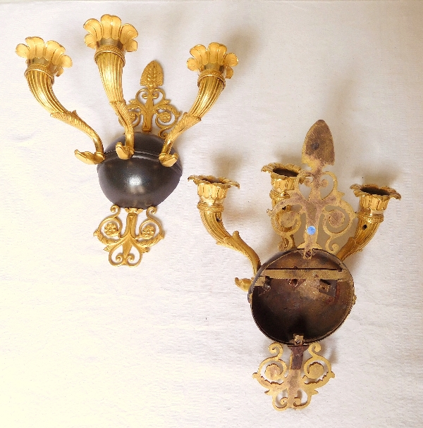 Pair of Empire ormolu and patinated bronze wall lights, early 19th century