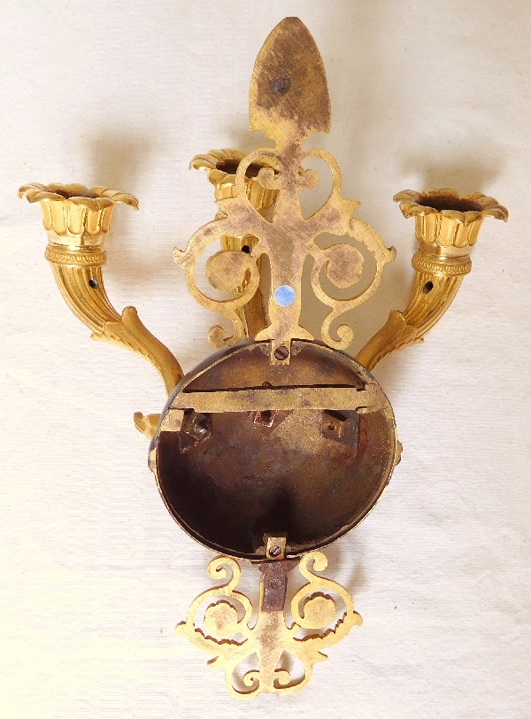 Pair of Empire ormolu and patinated bronze wall lights, early 19th century