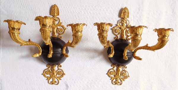 Pair of Empire ormolu and patinated bronze wall lights, early 19th century