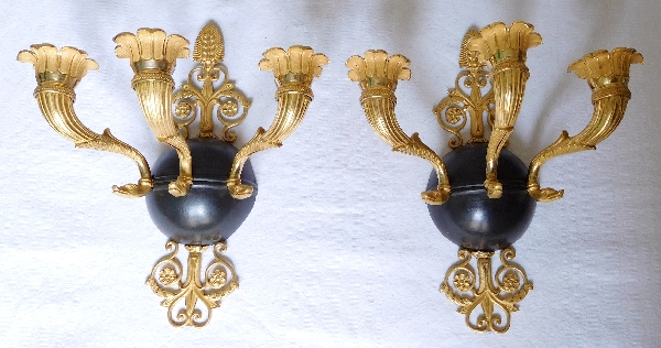 Pair of Empire ormolu and patinated bronze wall lights, early 19th century