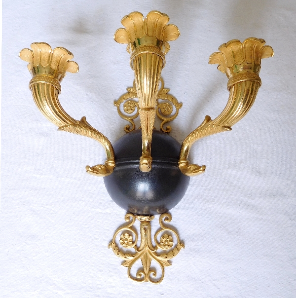 Pair of Empire ormolu and patinated bronze wall lights, early 19th century