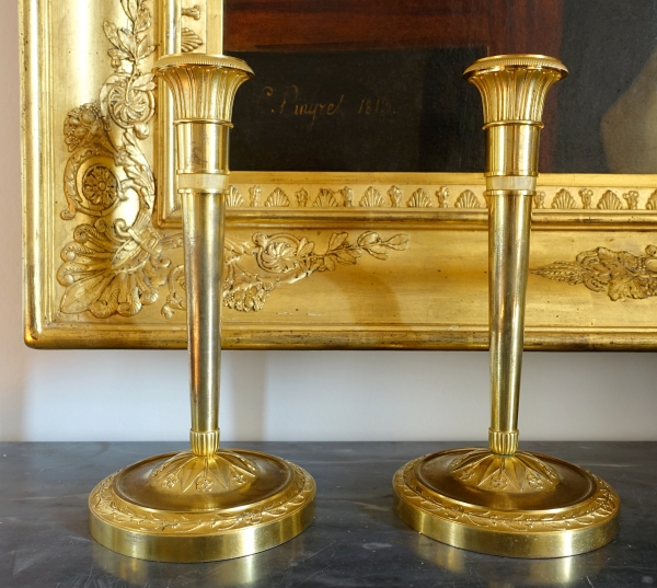 Pair of Empire ormolu candlsticks, early 19th century circa 1810
