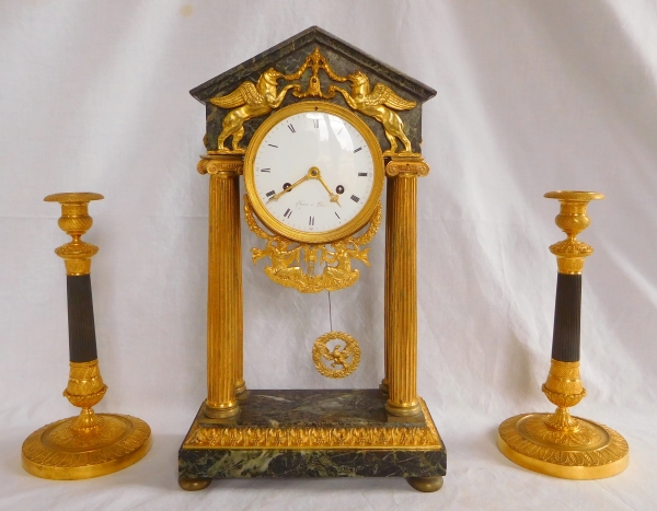 Pair of patinated bronze and ormolu candlesticks, early 19th century