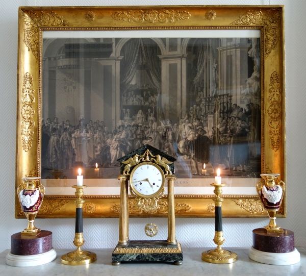 Pair of patinated bronze and ormolu candlesticks, early 19th century