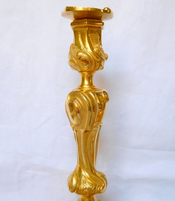 Pair of Louis XV style ormolu candlesticks after Meissonnier