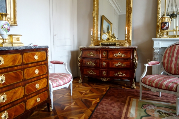 Pair of Louis XV style finely chiseled ormolu candlesticks, 19th century