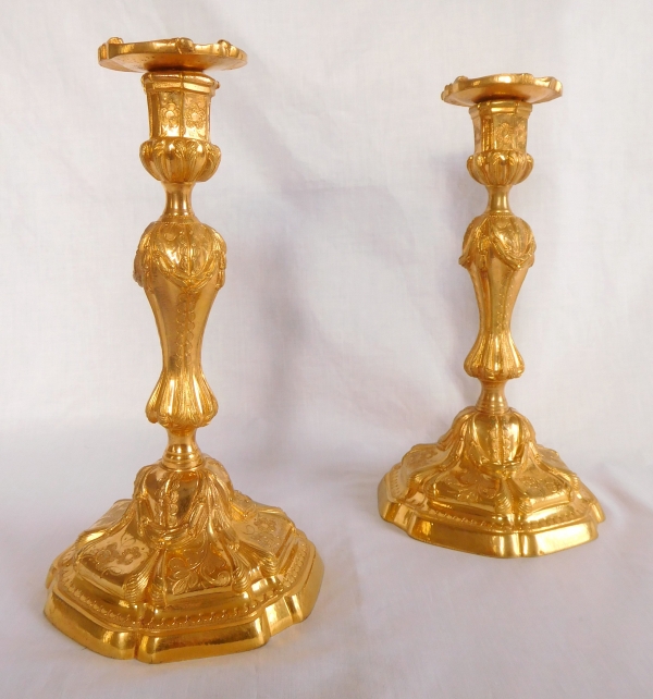 Pair of Louis XV style finely chiseled ormolu candlesticks, 19th century