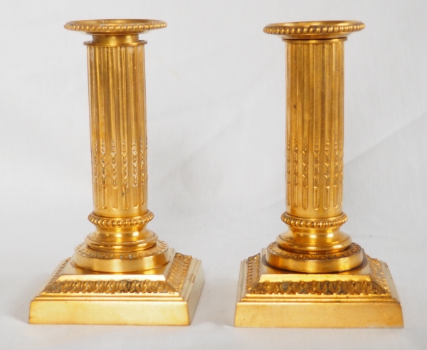 Pair of Louis XVI style ormolu candlesticks - 19th century