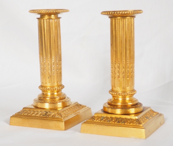 Pair of Louis XVI style ormolu candlesticks - 19th century