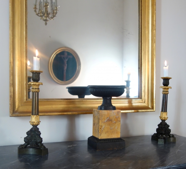 Pair of patinated bronze and ormolu tripod candlesticks, early 19th century