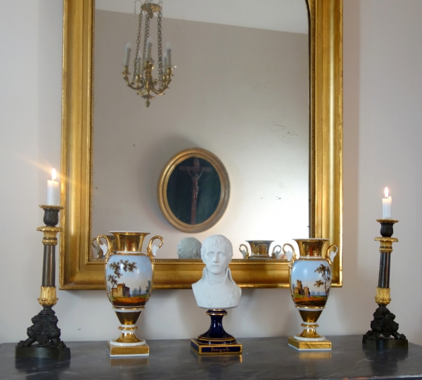 Pair of patinated bronze and ormolu tripod candlesticks, early 19th century