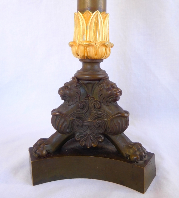 Pair of patinated bronze and ormolu tripod candlesticks, early 19th century