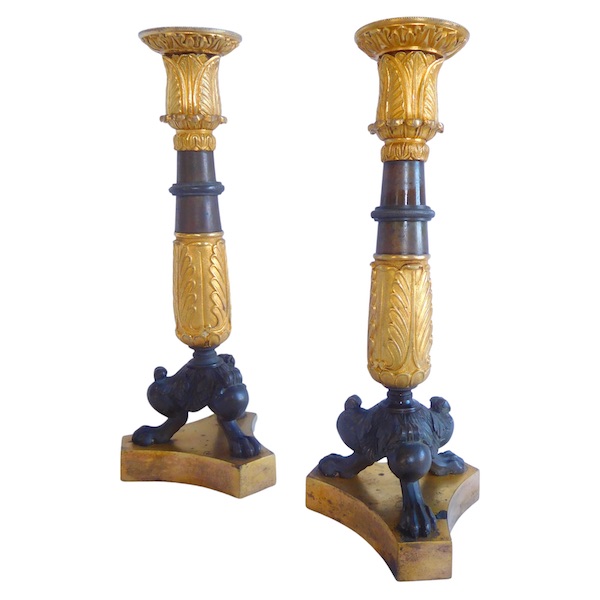 Pair of patinated bronze and ormolu tripod candlesticks, early 19th century
