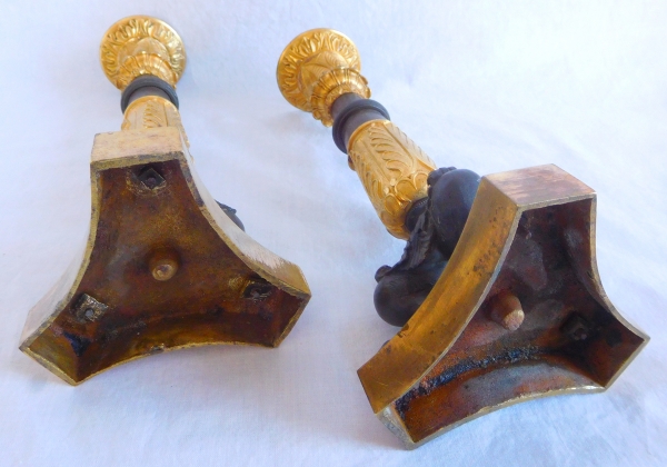 Pair of patinated bronze and ormolu tripod candlesticks, early 19th century